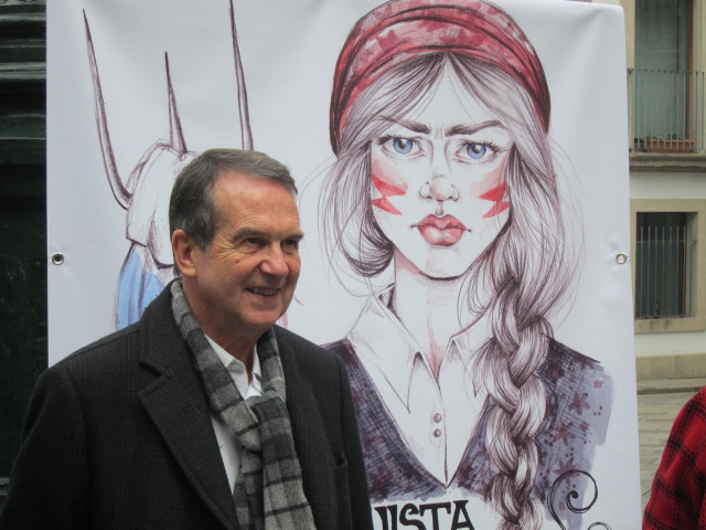 Abel Caballero con el cartel de la Reconquista 2019