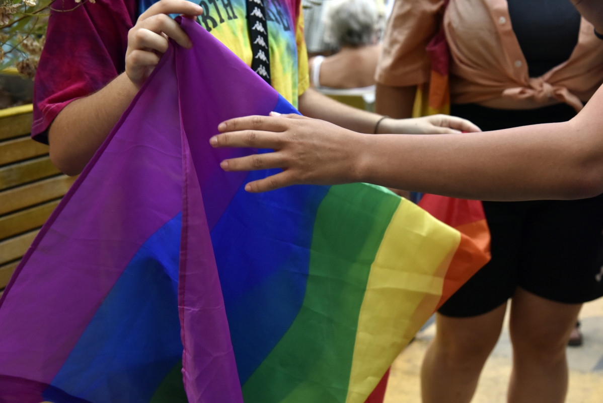 Archivo - Dos chicos sostienen la bandera LGTBI durante una manifestación para condenar el asesinato de un joven de 24 años el pasado sábado en A Coruña debido a una paliza, a 5 de julio de 2021, 