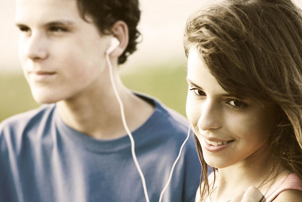 Teens sharing a song